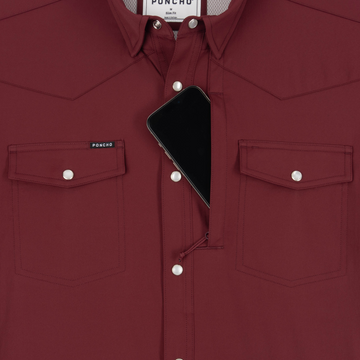 Phone in chest zipper pocket of shirt