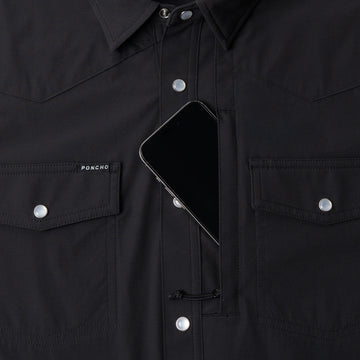 Phone in chest zipper pocket of shirt