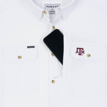 Phone in chest zipper pocket of shirt