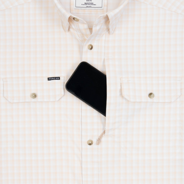 Phone in chest zipper pocket of shirt