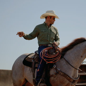 Cowboy wearing the Sabine while riding a horse