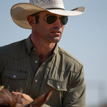 Cowboy wearing the Sabine while riding a horse