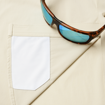 Closeup of sunglasses with lens cleaner on shirt