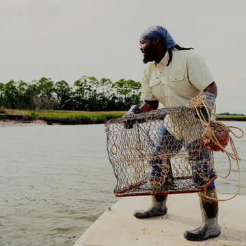 Man throwing a crab trap