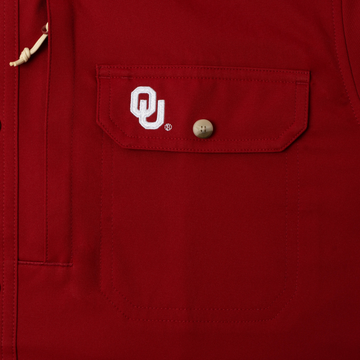 closeup of logo on pocket of shirt