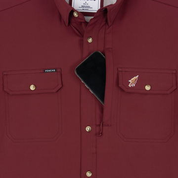Phone in chest zipper pocket of shirt