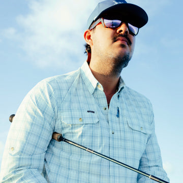 man with fishing rod wearing the silver king shirt