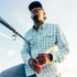 man holding fishing rod wearing the silver king shirt
