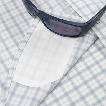 sunglasses with lens cleaner on shirt