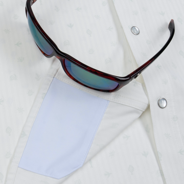 sunglasses with lens cleaner on shirt