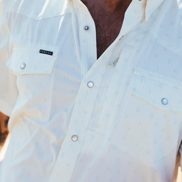 Close-up of The Surf No Turf outdoor shirt with snap buttons and chest pockets