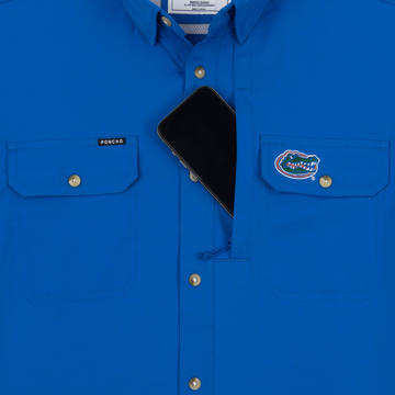 Phone in chest zipper pocket of shirt