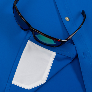 Closeup of sunglasses with lens cleaner on shirt
