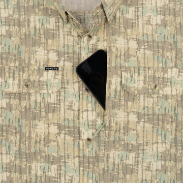Phone in chest zipper pocket of shirt