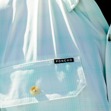 closeup of poncho logo on the tarpon sands shirt