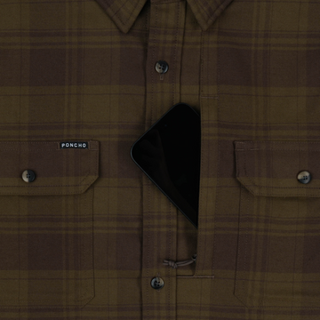 The Telluride shirt with a hidden zipper pocket holding a smartphone
