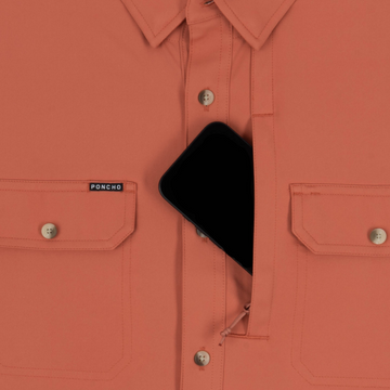 phone in chest zipper pocket of shirt