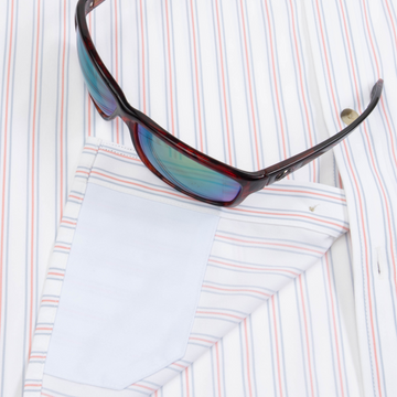 Closeup of sunglasses with lens cleaner on shirt