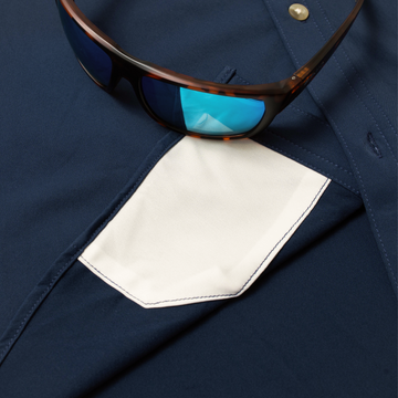 sunglasses with lens cleaner on shirt