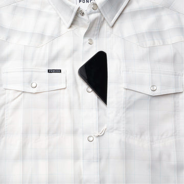 Closeup of sunglasses with lens cleaner on shirt