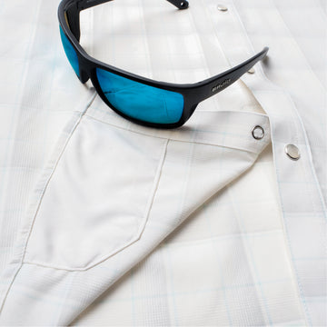 Phone in chest zipper pocket of shirt