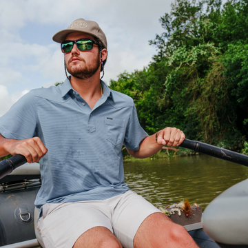 man rowing a boat while wearing The Wide Open