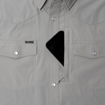 Phone in chest zipper pocket of shirt