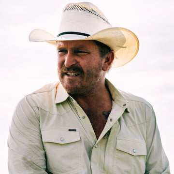 Man in Cowboy hat wearing The Workhorse shirt
