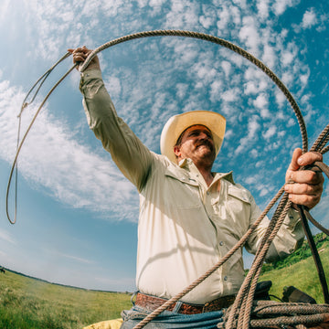 Man roping while wearing The Workhorse shirt