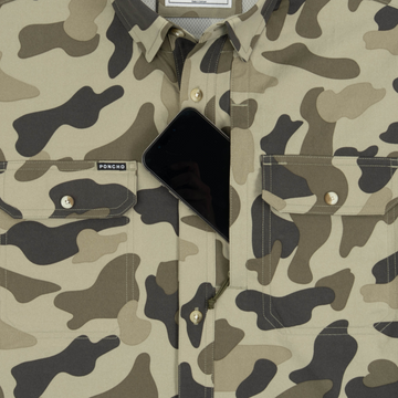 Phone in chest zipper pocket of shirt
