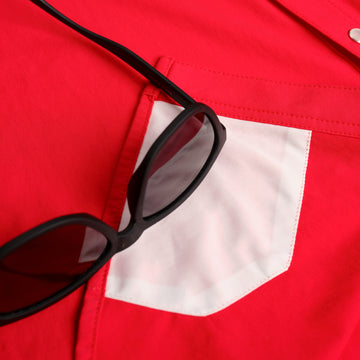 closeup of sunglesses cleaner on red shirt