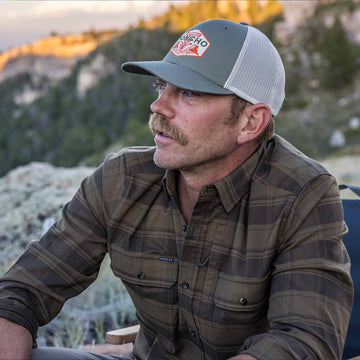 man wearing green plaid flannel