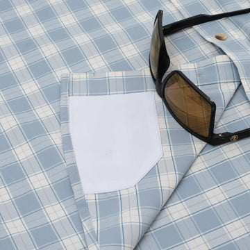 Close up of hidden sunglass cleaner on button down shirt