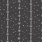 Close-up of dark fabric with vertical lines and small white geometric patterns